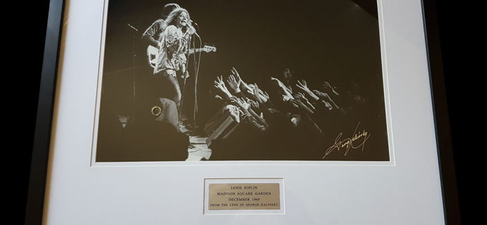 Janis Joplin Framed Photograph In 1969, rock legend Janis Joplin played New York’s Madison Square Garden with her Kozmic Blues Band. She was joined on stage that night by Johnny Winter, Tina Turner and the Paul Butterfield Blues Band. Rock photographer George Kalinsky was there that night and shot this amazing image of Janis, which he’s signed and framed. Rock royalty captured forever.
